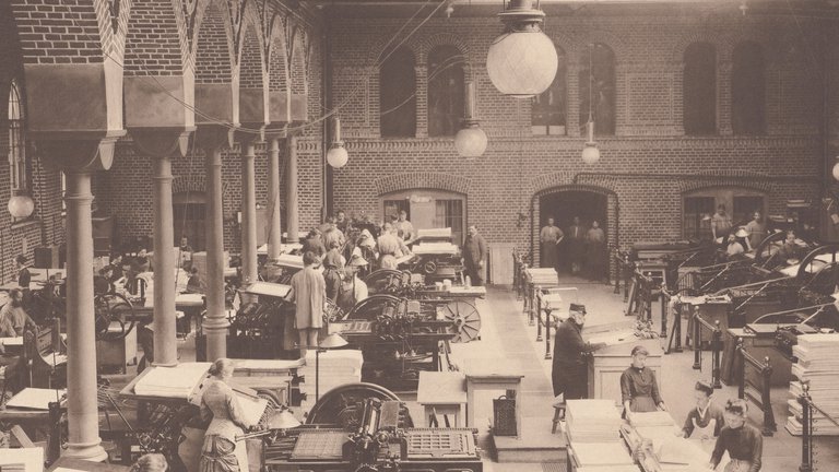Sepia-toned image of people working in a printing house.