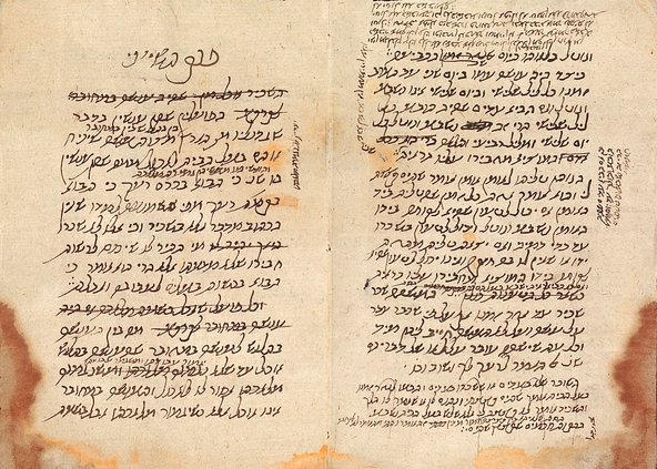 Pages of a stained manuscript with aging marks and Hebrew writing-